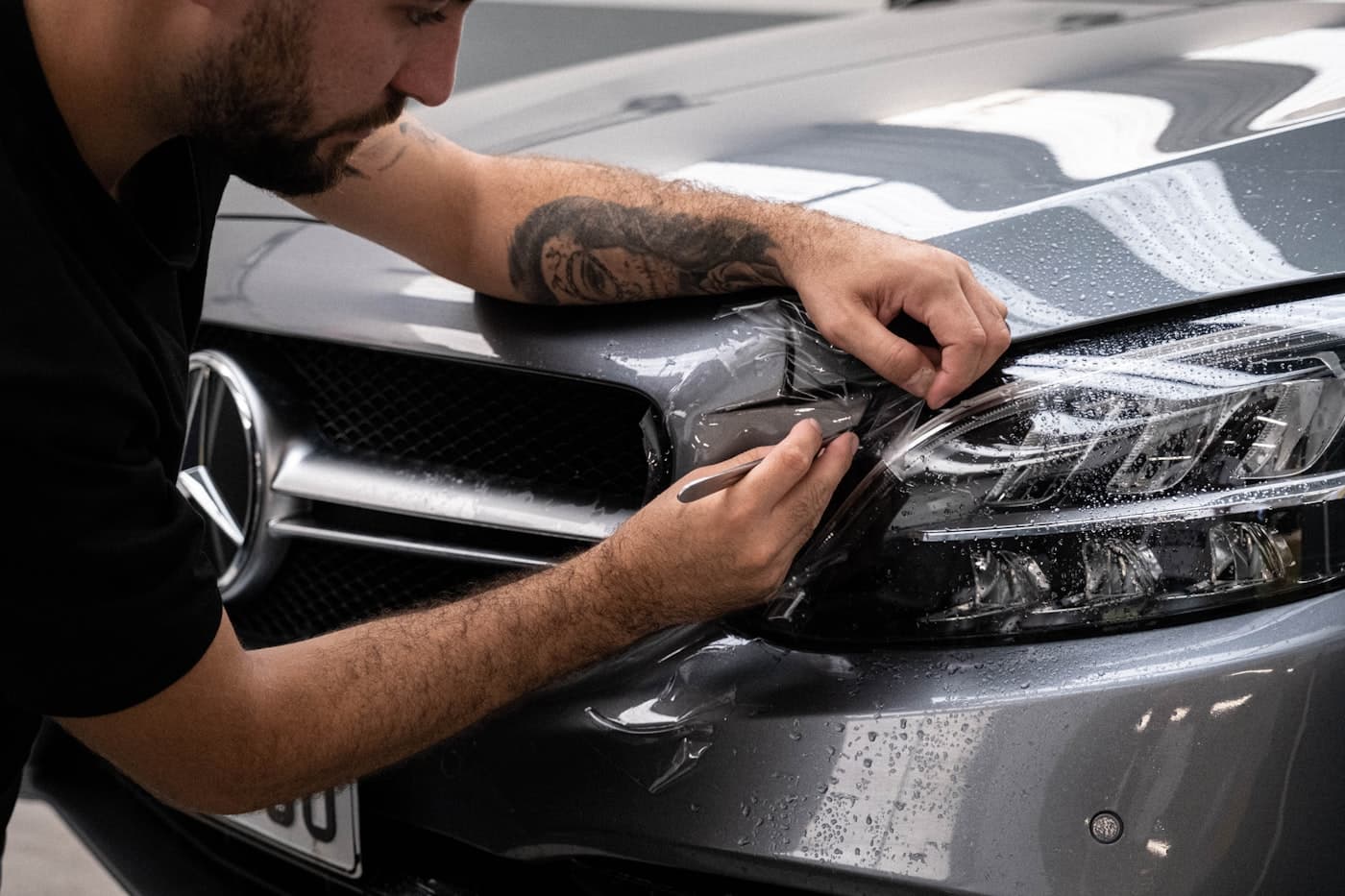 Technician working on a Mercedes-Benz at Mends Autolab